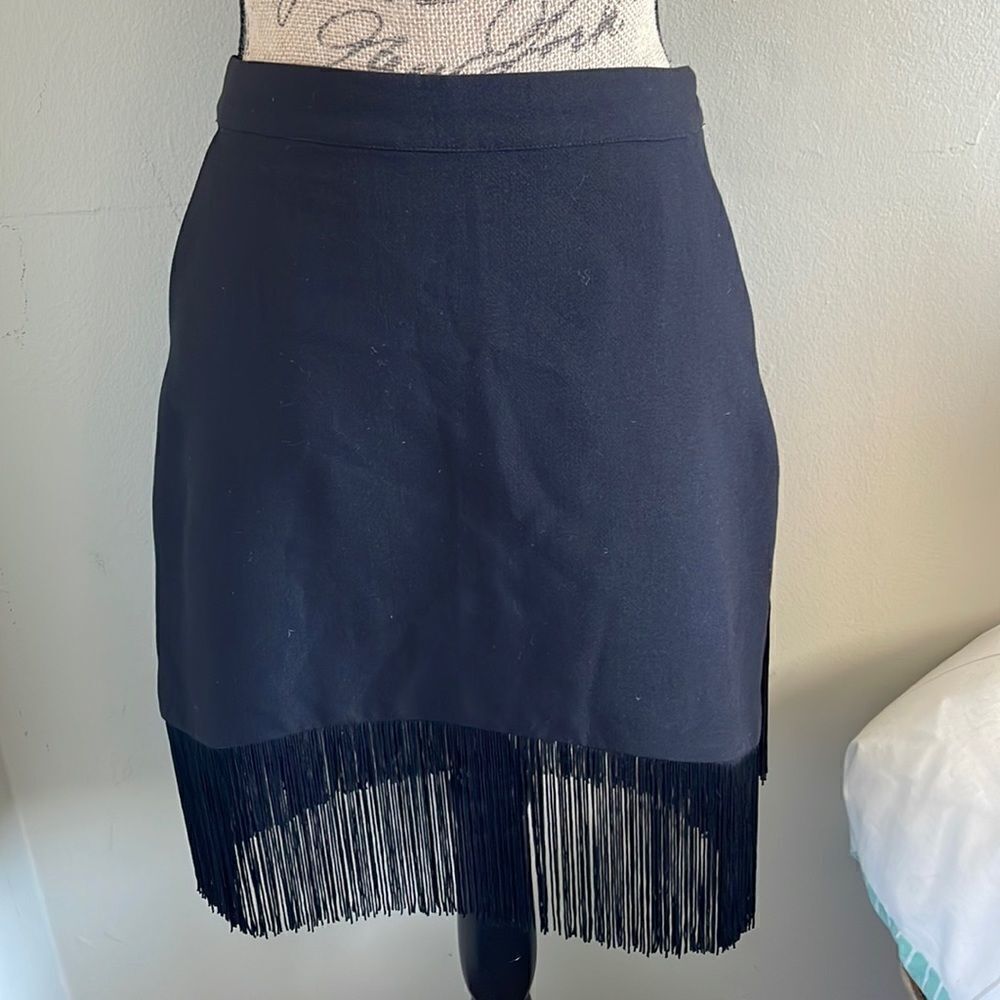 {tl} the letter Black Skirt with bottom fringe/tassels